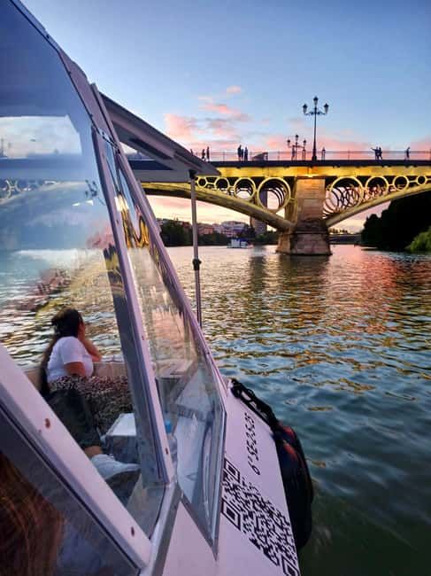Seville: Sail the River. 100% private - Setting off beneath Triana Bridge