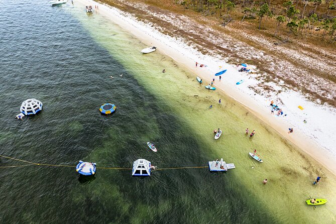 Shell Island Inflatable Adventure Park & Dolphin Sightseeing Tour - Weather and schedule risks