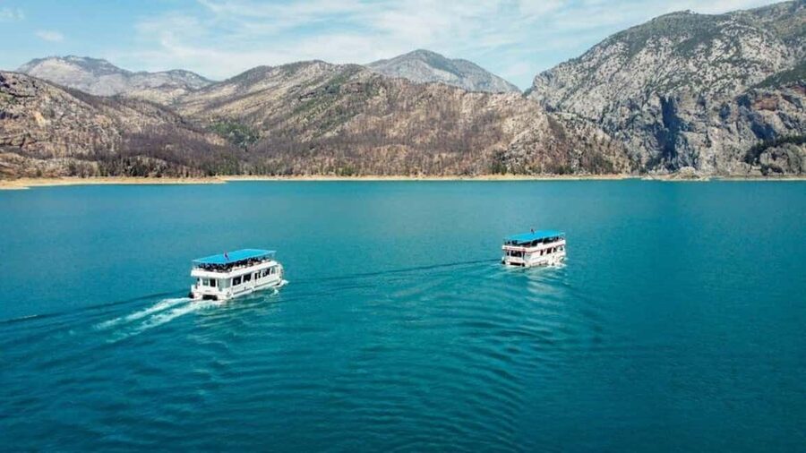 Side: Guided Tour and Electric Catamaran Cruise, Waterfall - Orange groves and the village house
