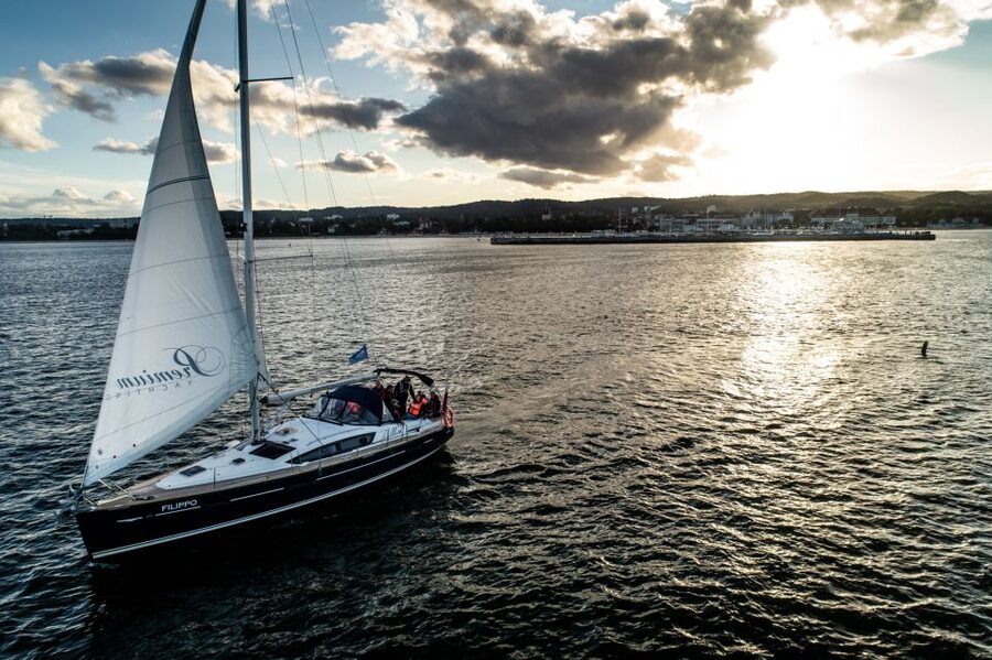 Sopot: Sunset Yacht Cruise with Welcome Drink - Steering the yacht with the skipper