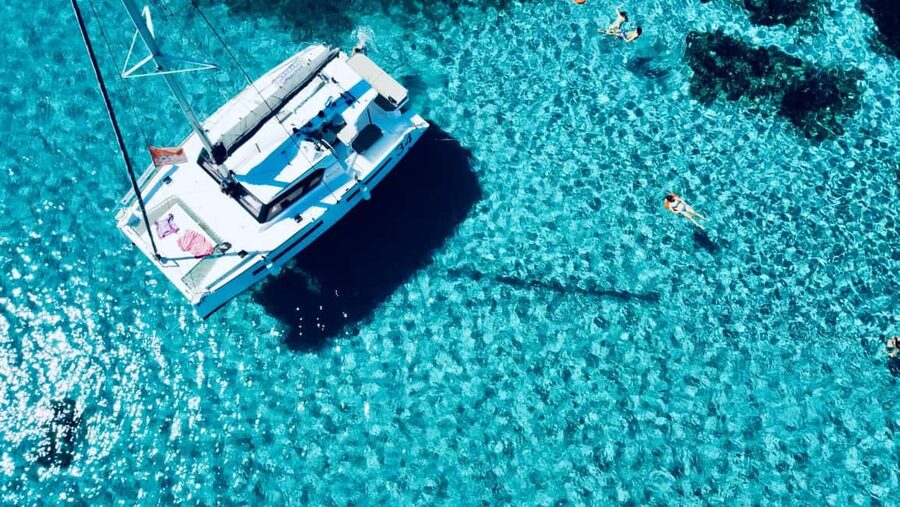 Stintino: Half-day catamaran tour to La Pelosa with aperitif - Meeting the Catamaran at Stintino