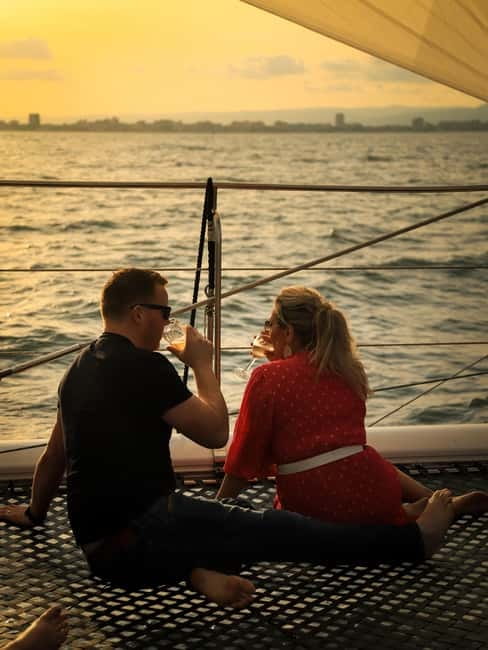 Sunny Beach: Sunset Catamaran Cruise with Dinner & Prosecco - Anchored for sunset over the bay