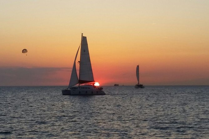 Sunset Catamaran Expedition in front of Cafe Mambo - Swimming, snorkeling, and the paddleboard