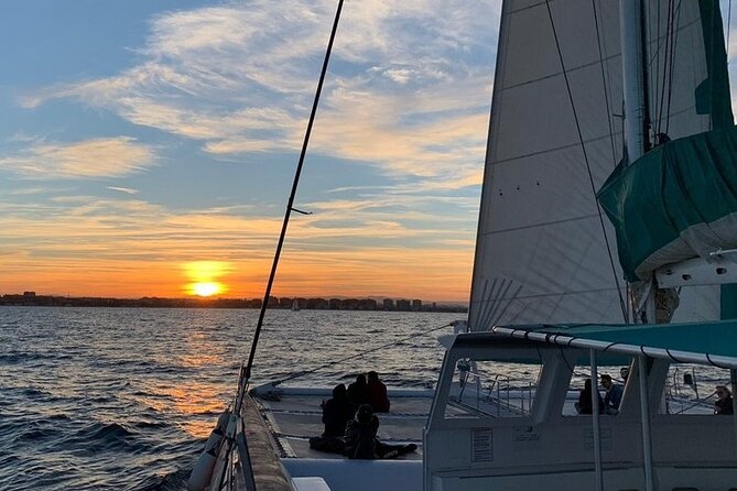 Sunset in Dénia from the Catamaran Mundo Marino - The Cava service and onboard mood