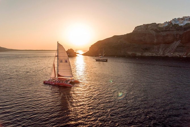 Sunset Sailing Catamaran Cruise in Santorini with BBQ and Drinks - Sailing past the volcano and Palea Kameni