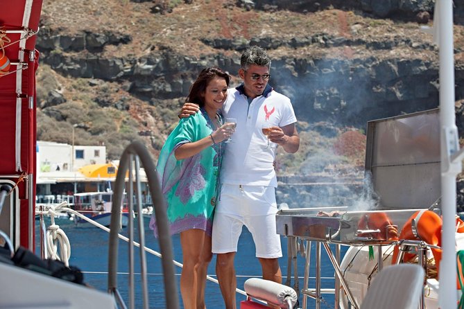 Sunset Sailing Catamaran Cruise in Santorini with BBQ and Drinks - Swimming near Santorini’s hot springs
