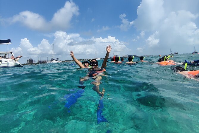 Top Isla Mujeres Catamaran Tour with Snorkel Open Bar and Buffet lunch - El Meco Reef and the short snorkeling stop