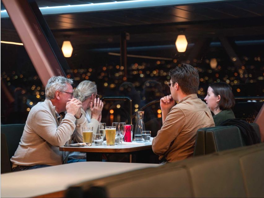 Tromsø: Aurora Dinner Cruise by Hybrid-Electric Catamaran - Warm saloons and Tromsø after sunset