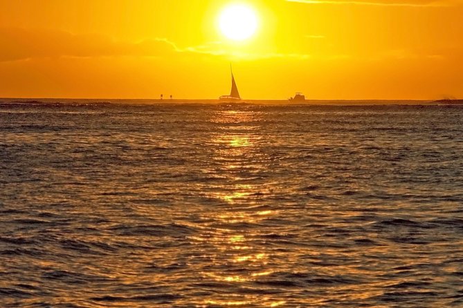 Waikoloa Signature Catamaran Sunset Sail - Sailing past lava and blue Pacific water