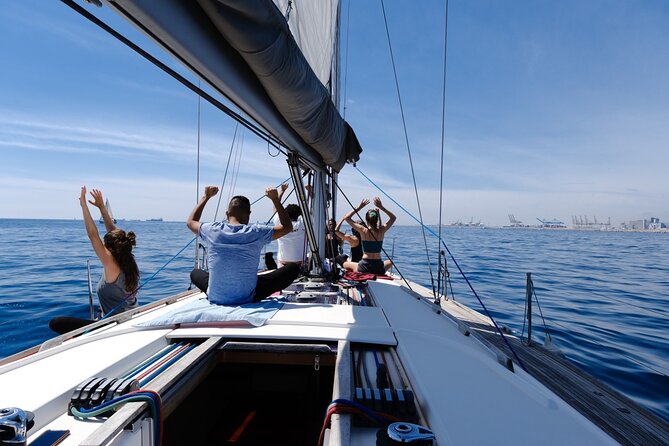 Yoga Session and Sailing Adventure in Barcelona - Sailing past Barcelona’s beach and monuments